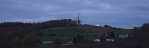  A fracking pad lights up the evening sky.