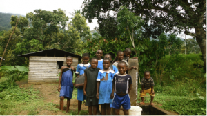 Children at stand tap near the Chief's compound in Ebasse. Some were too shy to smile for the picture!
