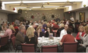 Corps employees enjoying a holiday party. Photo taken from Yankee Engineer, December 2015