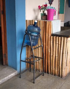 The "garrafón de agua" at the INSO office. It tips in its stand so you can fill up a bottle or glass.